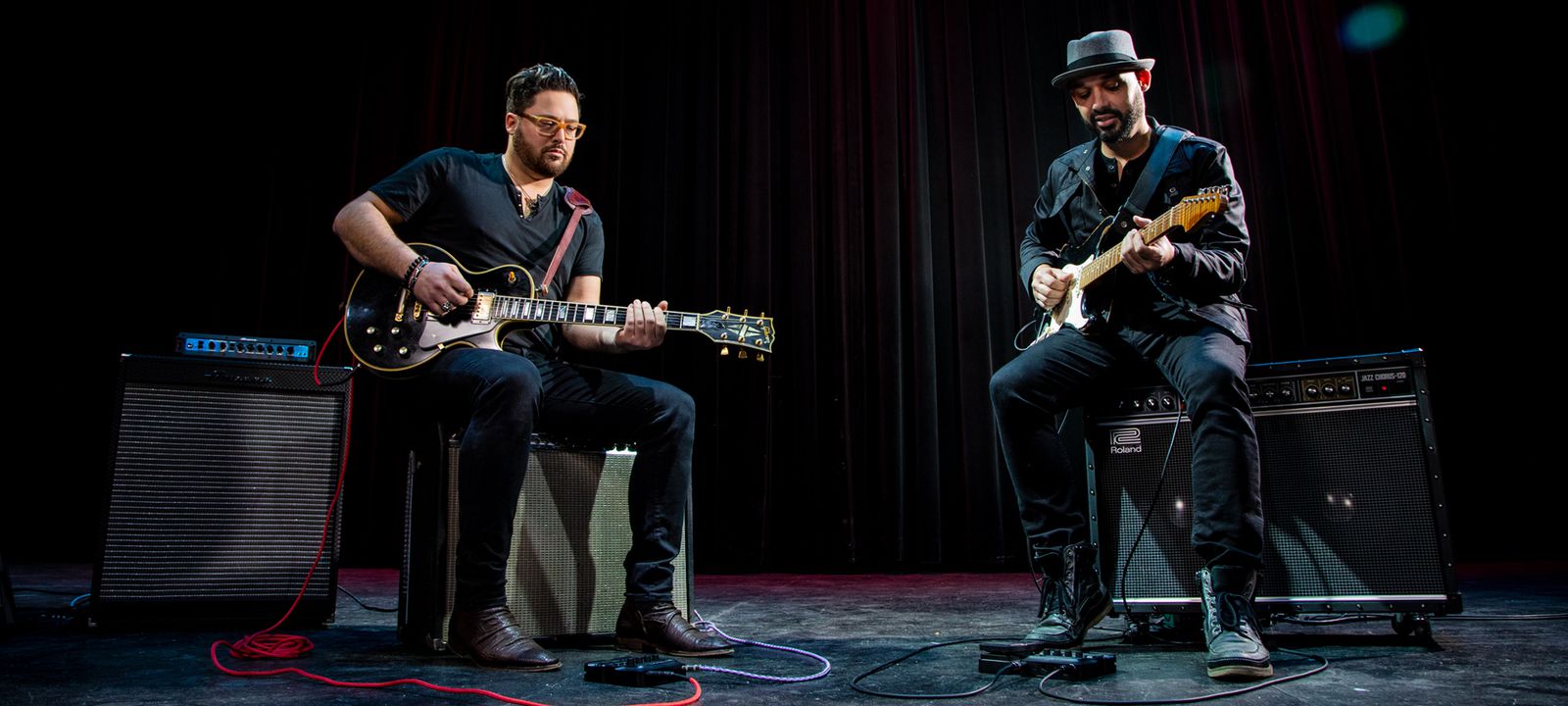 Two musicians playing guitar