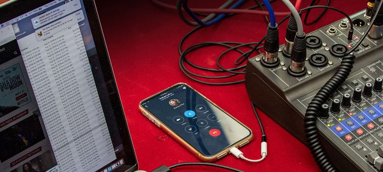 LiveTrak L-8 on table with laptop and iphone