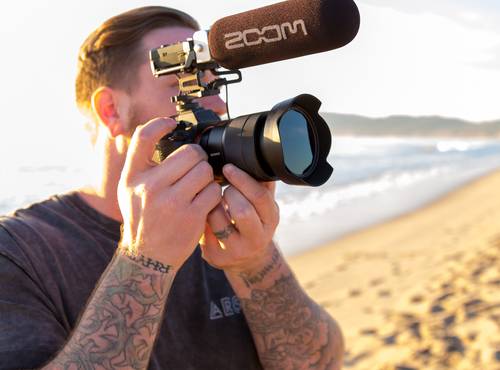 Videographer recording with a DSLR and a F1-SP on Venice Beach, California
