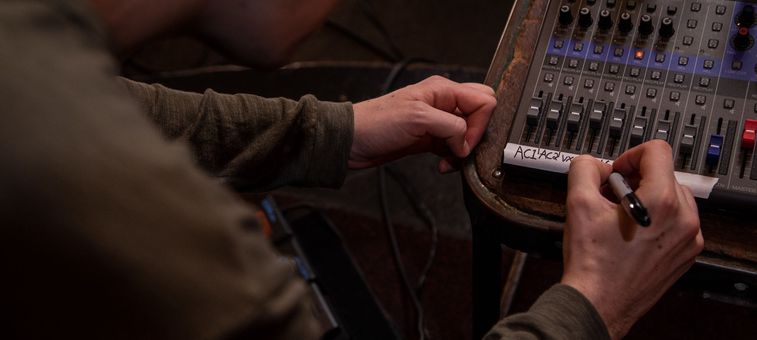 Person Writing on L-8