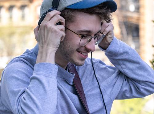 Guitarist Justin Lindsay monitoring though his headphones