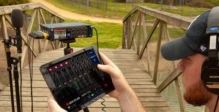 Sound engineer using an iPad to adjust recording with F8n and an Ambeo microphone