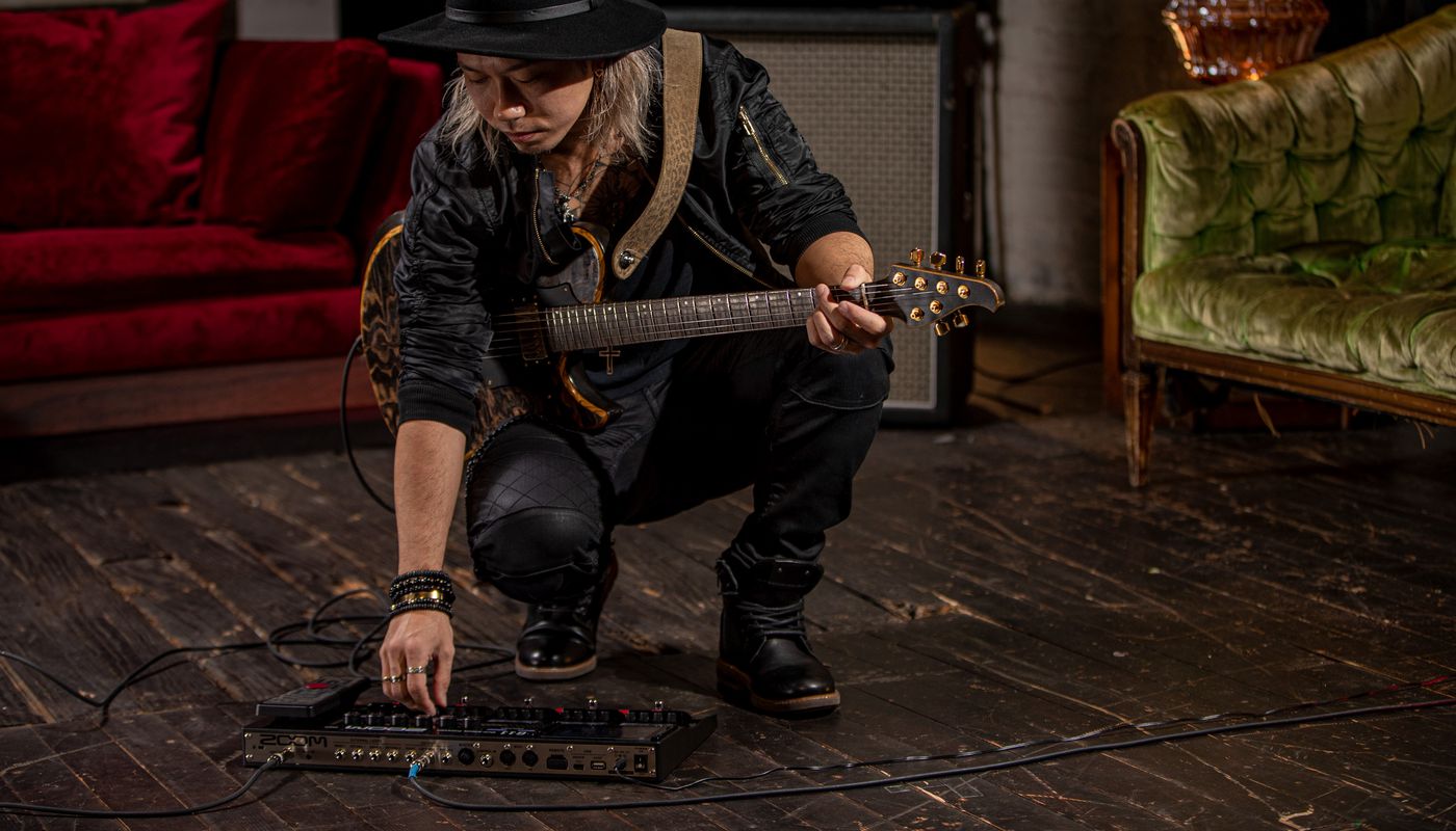 Guitarist, Kappa, making adjustments to the G11