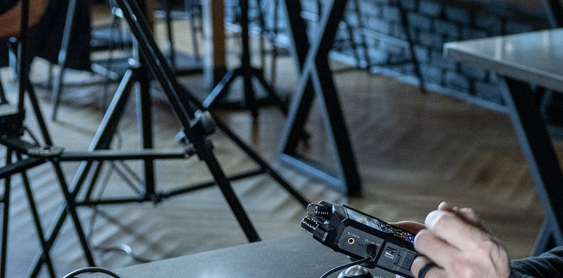 Recording engineer using headphones to monitor the sound being recorded with H4essential
