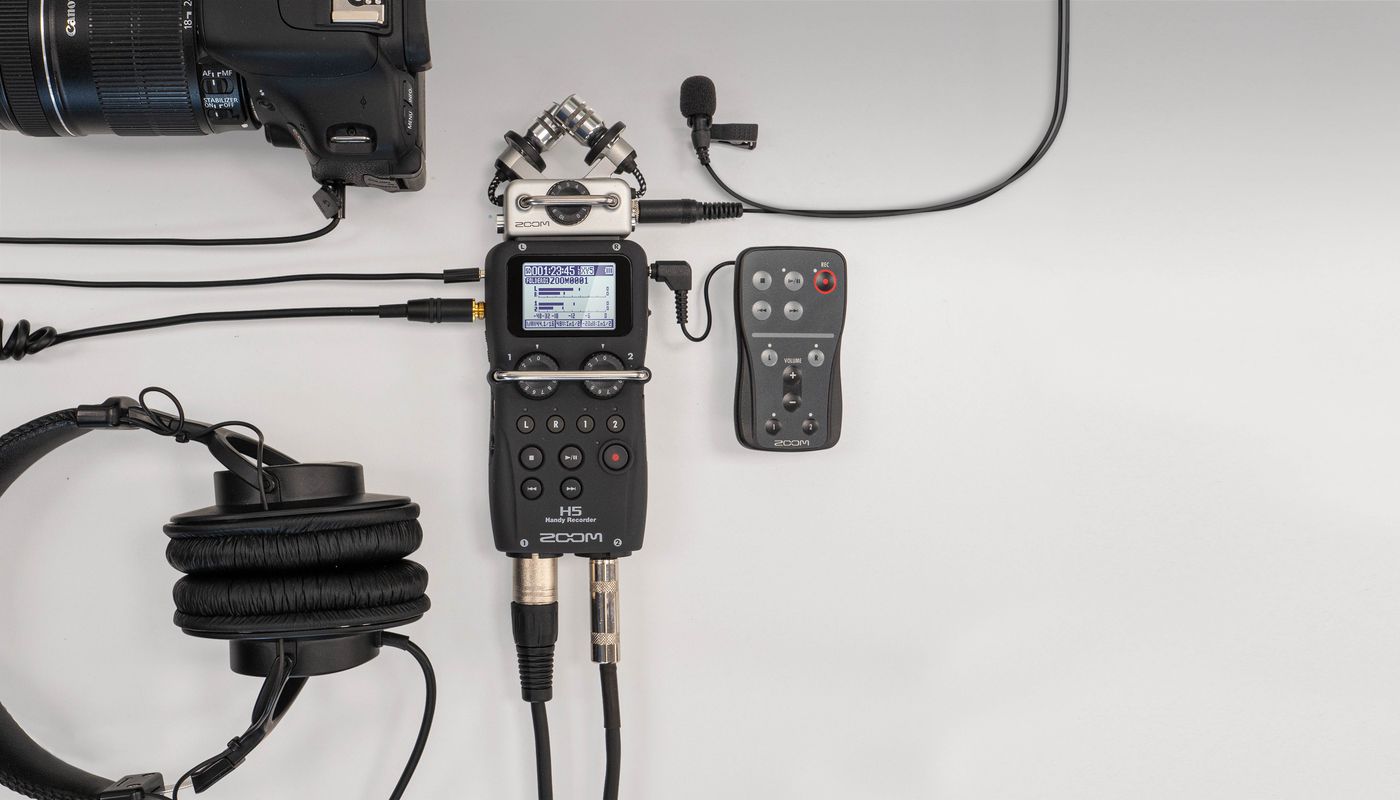 H5 with headphones, remote control, lavalier and camera plugged into it.