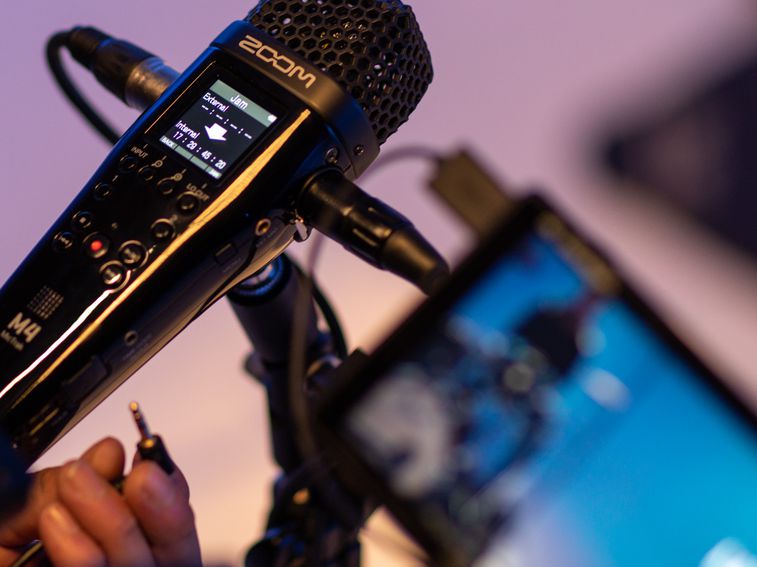Sound engineer jam-sync’ing timecode with the M4 and a video camera