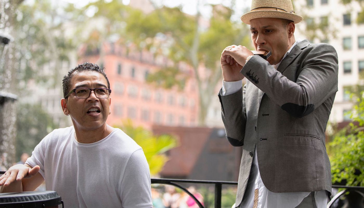 harmonica and percussion duet in the park being recorded with a Q2n-4K
