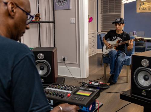 Omar Hakim mixing live sound through the R20 with studio monitors