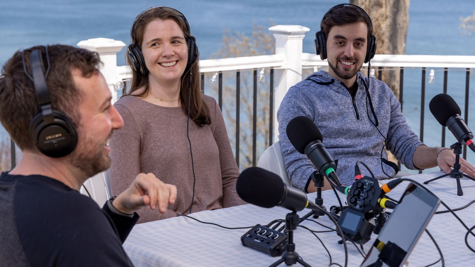 podcasters with headphones attached to the ZHA-4