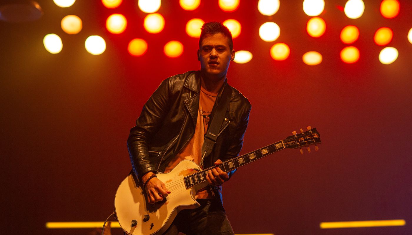 Jacob Scibbie playing guitar