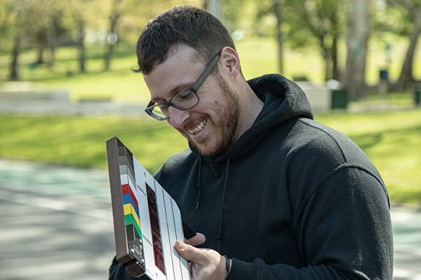 Smiley person with slappy movie stick